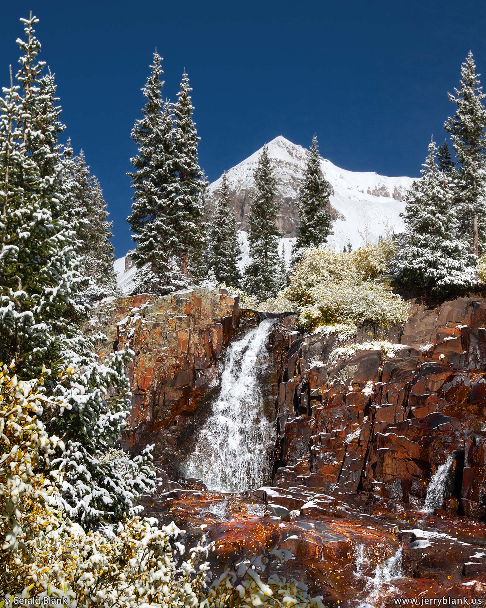 #06612 - Snow covers autumn foliage around a waterfall on Sneffels Creek, in Yankee Boy Basin in the Colorado landscape, with Cirque Mountain in the background
