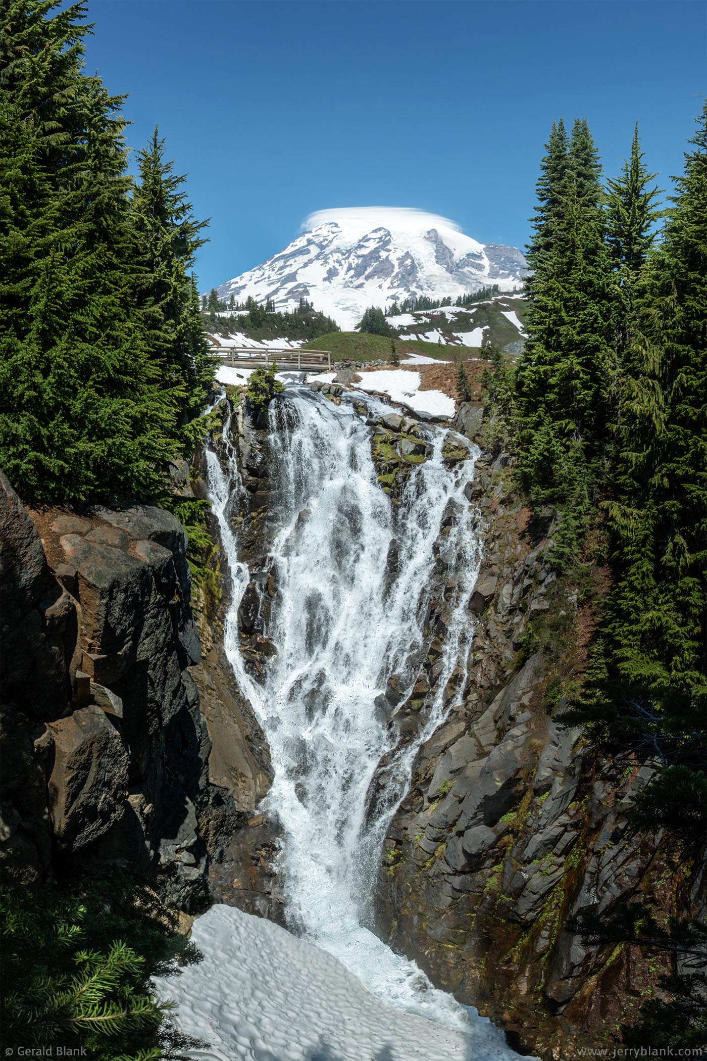 #31763 - The peak of Mount Rainier can be seen between the trees surrounding Myrtle Falls on Edith Creek, in Mount Rainier National Park, Washington - photo by Jerry Blank