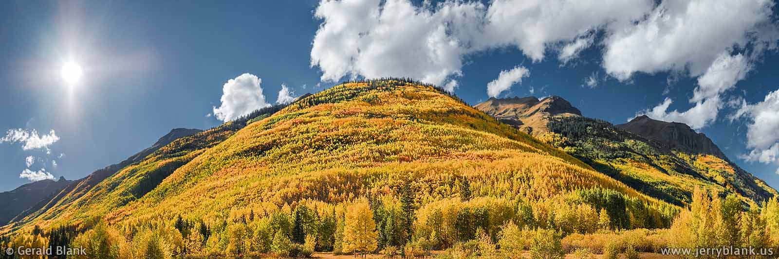 #43766 - An amazing panorama of autumn color on the foothills of Hayden Mountain in Colorado, as seen from US Hwy. 550 south of Ouray - photo by Jerry Blank